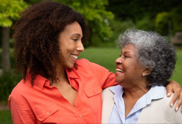 Mother Daughter Smiling at one another