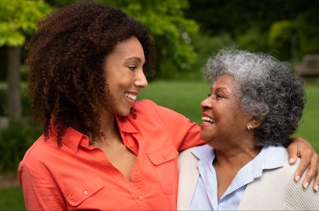 Mother Daughter Smiling at one another