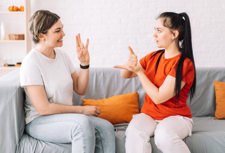 Women doing sign language