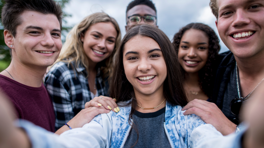 Young adults smiling for a selfie